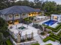 The palatial home has stunning gardens ideal for entertaining including a large pool and cabana. Pic: Supplied