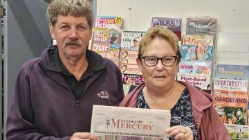 Phil and Margaret Downey hold the latest print edition of the Lithgow Mercury. Picture by Reidun Berntsen.