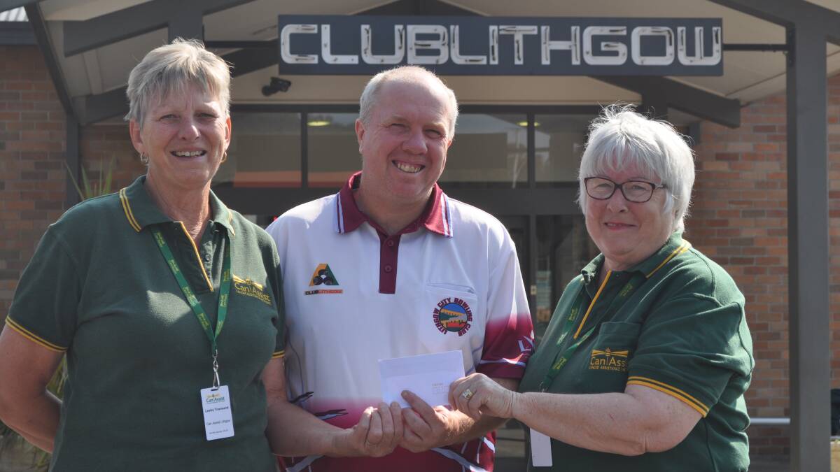 AIDING CANASSIST: Men's sub-body president Dave Robson hands over a cheque for $400, proceeds from an ongoing fundraising effort, to Can Assist representatives and well known local bowlers Lesley Townsend and Anne Anderson.