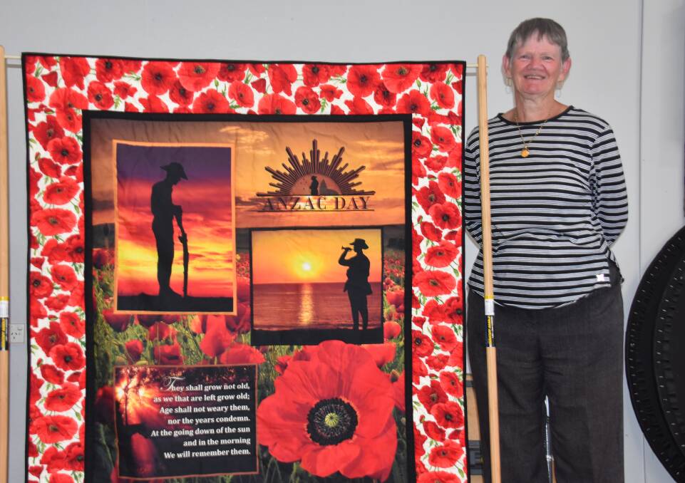 Sandra Haley with the quilt she made hanging up in the Wallerawang Bowling Club. Picture: CIARA BASTOW