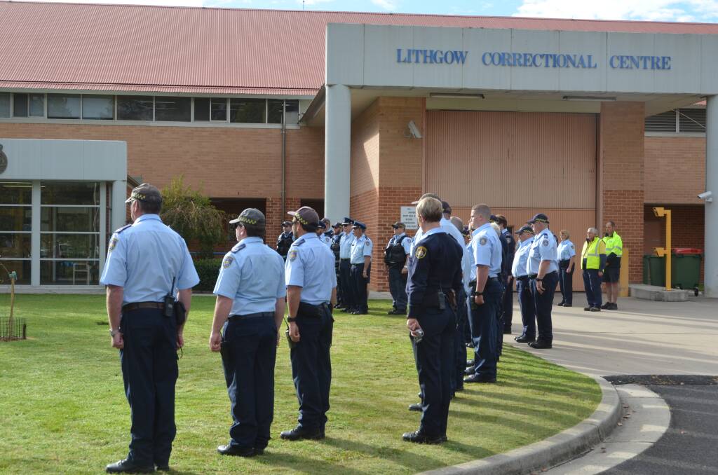 Officers stand to attention at the Anzac Day ceremony at Lithgow Correctional Centre. 