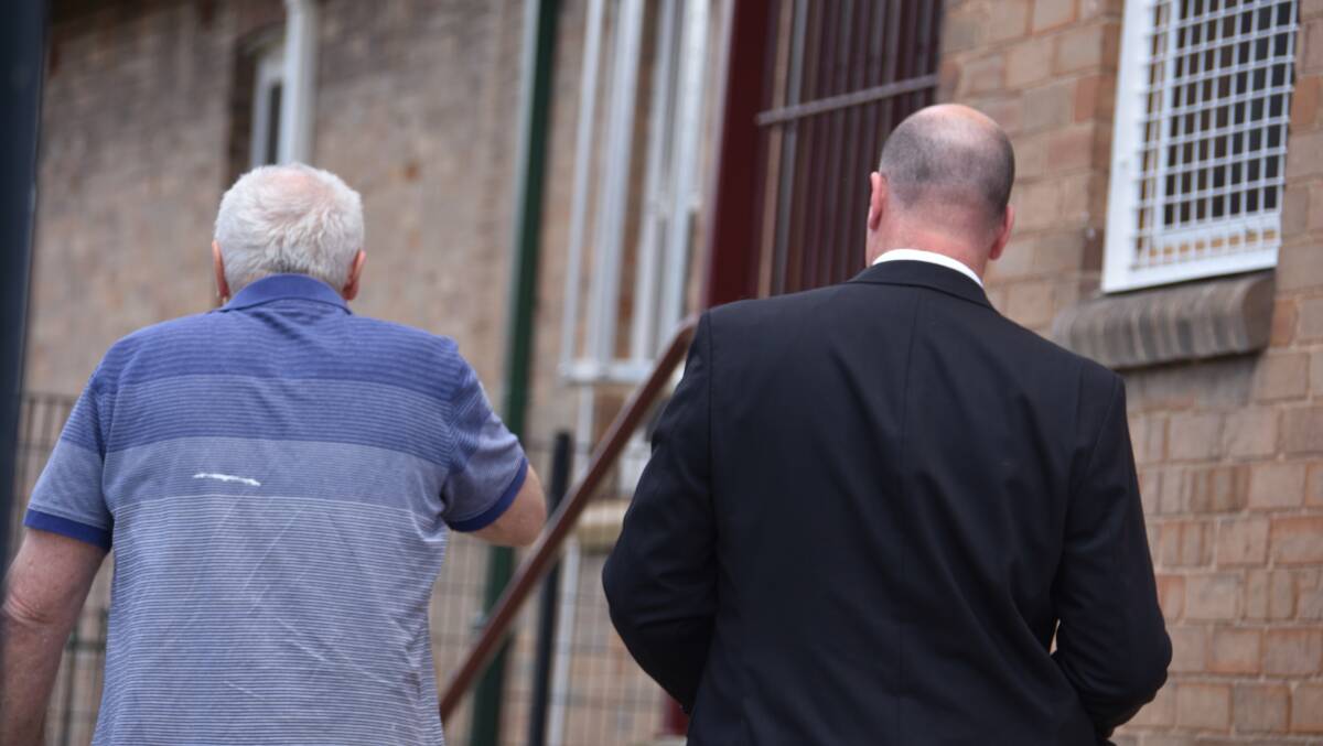ENTERING COURT: Paul John Fitzpatrick is escorted to Lithgow Local Court. Picture: KIRSTY HORTON. 