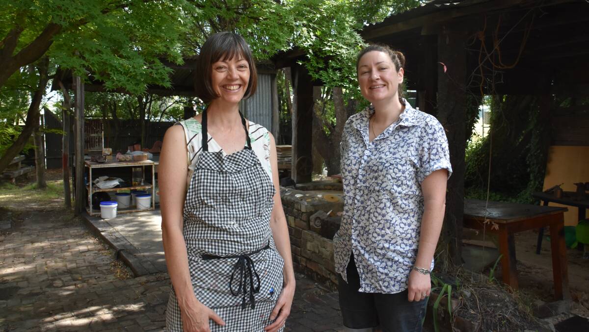 COURTYARD: Artists Sarah O'Sullivan and Jacqueline Spedding at the Lithgow Pottery. Picture: PHOEBE MOLONEY. 