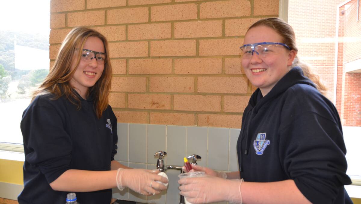 WOMEN IN STEM: Faith Capomolla and Lara Compton from Lithgow High School make thermochromic slime.