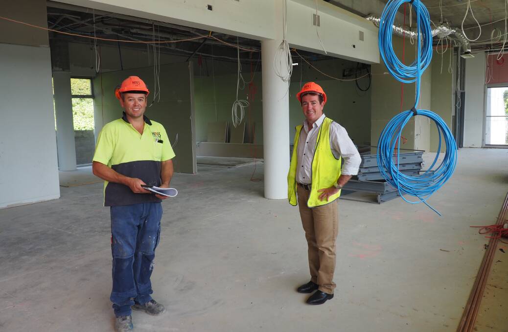 ON THE JOB: Site foreman of the Lithgow TAFE upgrade, Craig Grover, and MP Paul Toole. Picture: SUPPLIED. 