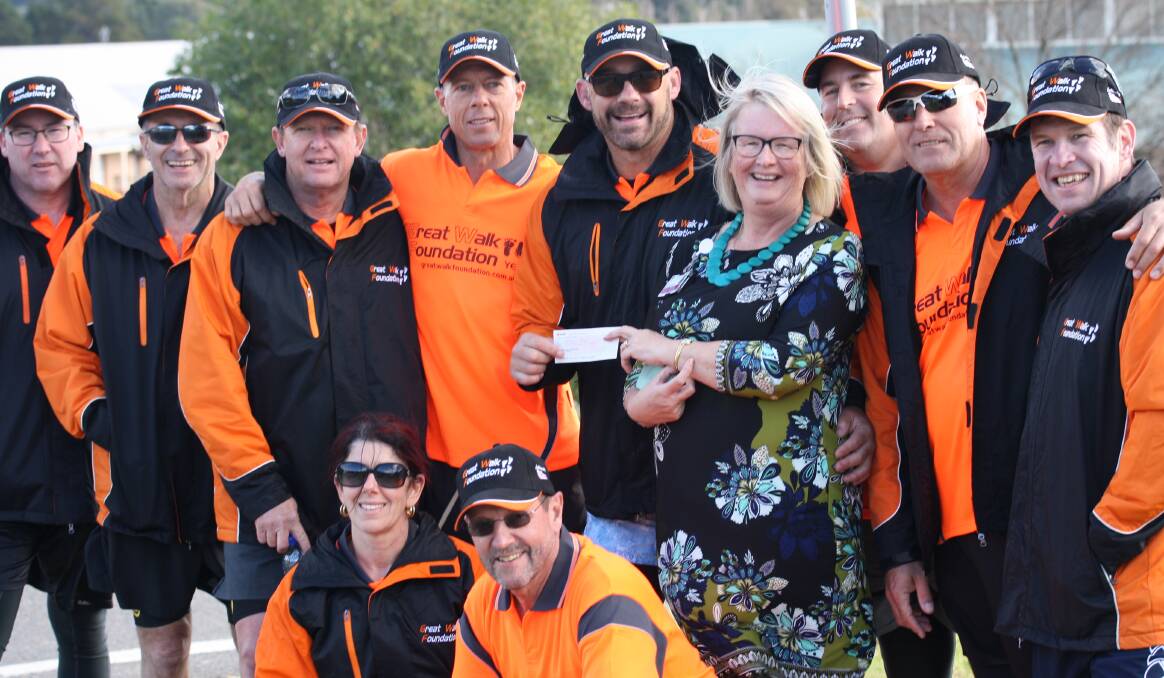 MONEY WALKS: Mark Geyer presents the cheque to Lithgow Hospital’s general manager, Jill Marjoram, with the Great Walk team.