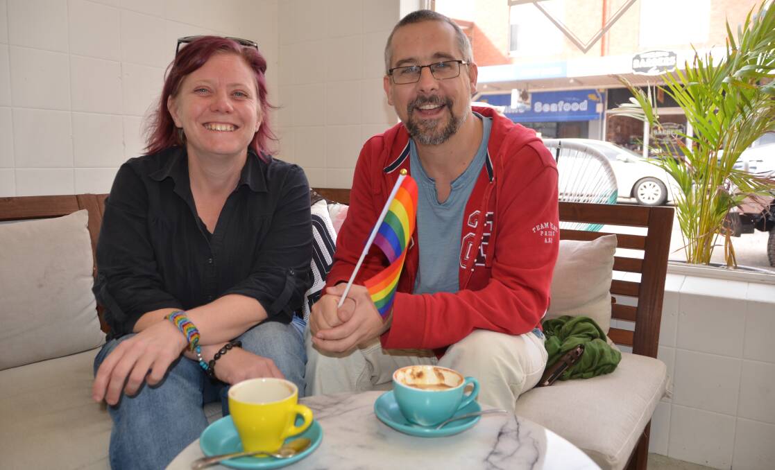  WAVING THE RAINBOW FLAG: Ali Kim and Rowan Fox of the Rainbow Lithgow group. Picture: PHOEBE MOLONEY. 