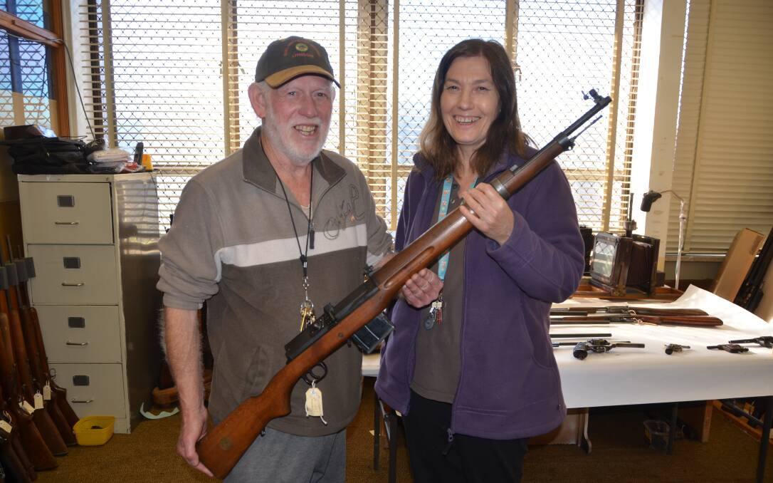 AMNESTY FINDS: Lithgow Small Arms Factory Museum volunteers Kerry Guerin and Donna White hold a Ljungman Swedish rifle donated as part of the national gun amnesty ending in September. Picture: PHOEBE MOLONEY.  