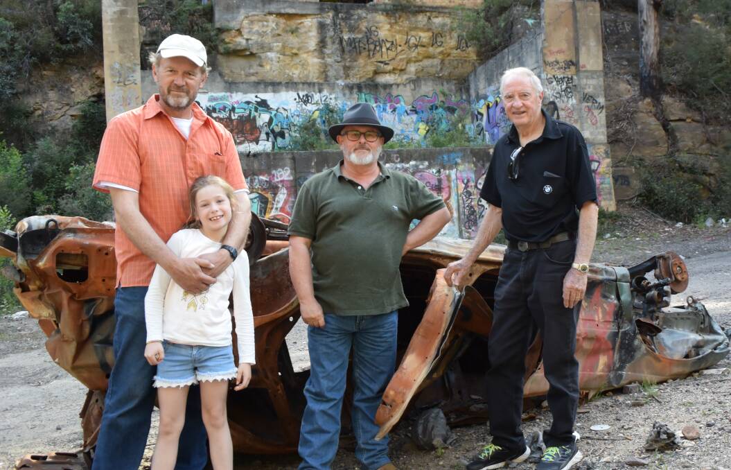 DOBBS DRIFT: Museum member John Oates, Alex Attree, president Ray Christison and vice president Darryl Cooper stand in front of a car shell that has been left on the museum's property. Picture: PHOEBE MOLONEY.  