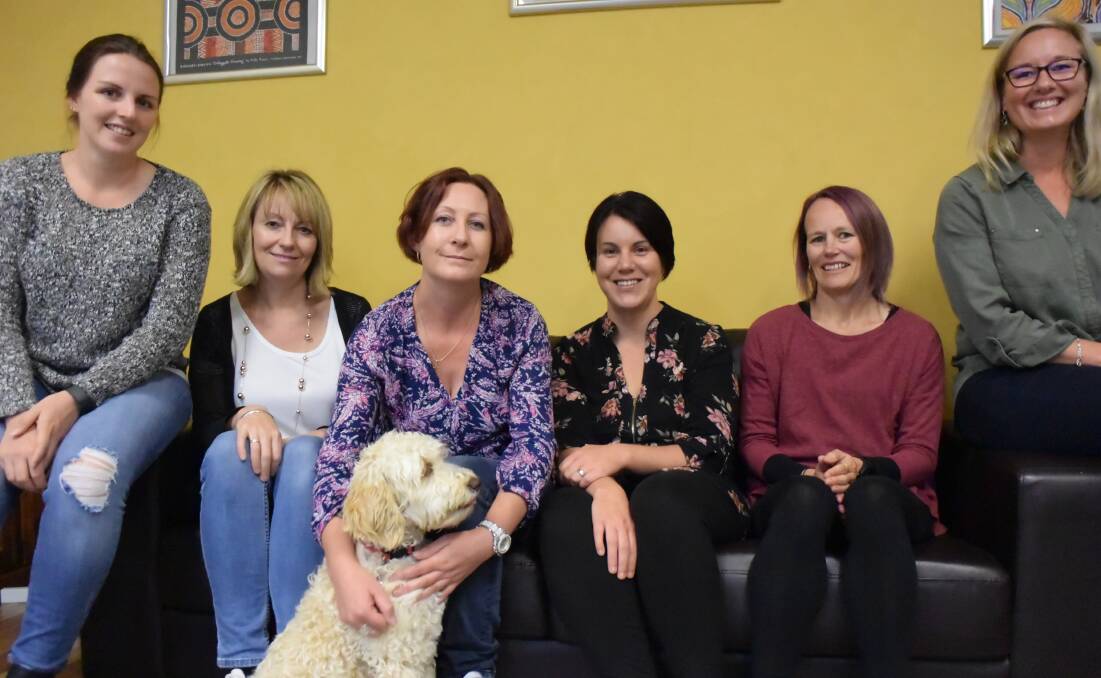 MORE SEEKING SUPPORT: The LCP team Lisa Matthews, Natalie Bishop, Michelle Ringin, Erin Ellery, Deonne Kinney, Cath Hungerford and Hope, the service's therapy dog. Picture: PHOEBE MOLONEY.
