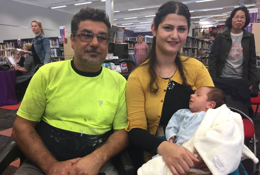 Salwa Bashar, her husband Nawwaf Mirza and newborn Roy at Lithgow Library. Ms Bashar was given an award on International Women's Day by Lithgow City Council recognising her dedication to volunteering. 