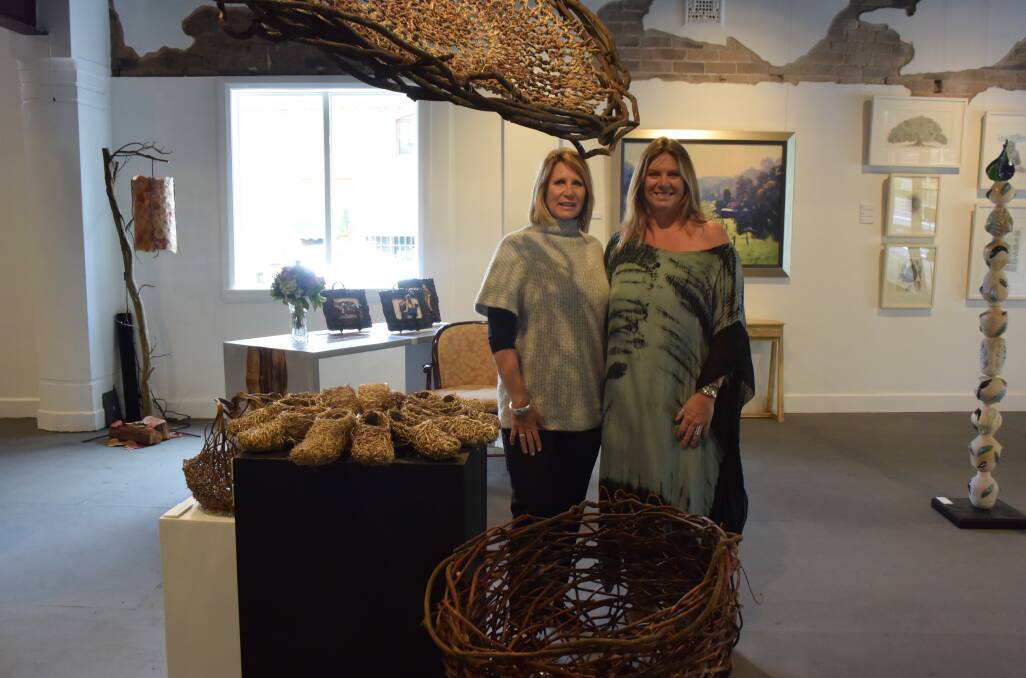 SCULPTURED SPACE: Sharon Howard and Kaylene Brooks with woven works by Jilliand Culey and Carolyn Dance. 