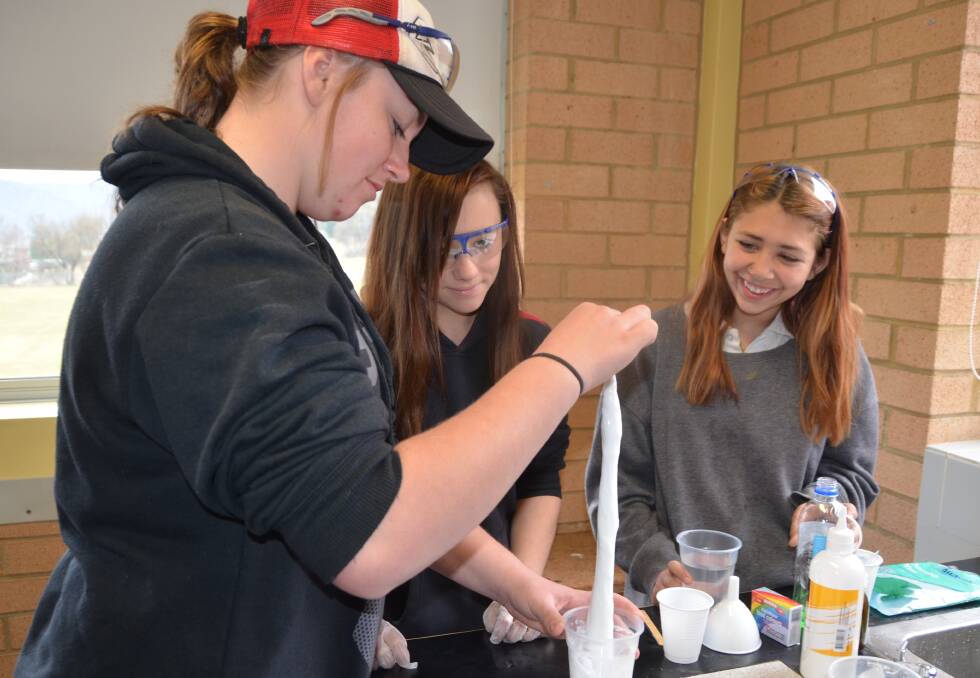 SLIME TIME: Portland Central students Maddye Neaves, Jasmine Tregear and Mikaila Milne make thermochromic slime. Picture: PHOEBE MOLONEY. 