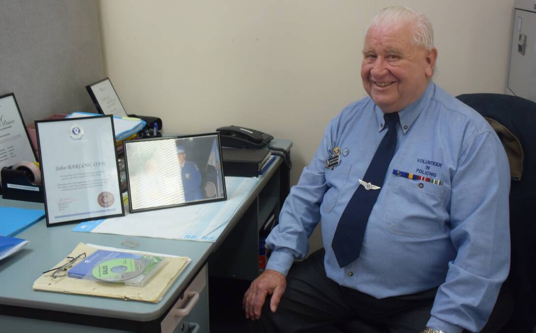 TWENTY YEARS OF SERVICE: John Barlow OAM at his desk in the Lithgow Police Station. Picture: PHOEBE MOLONEY. 