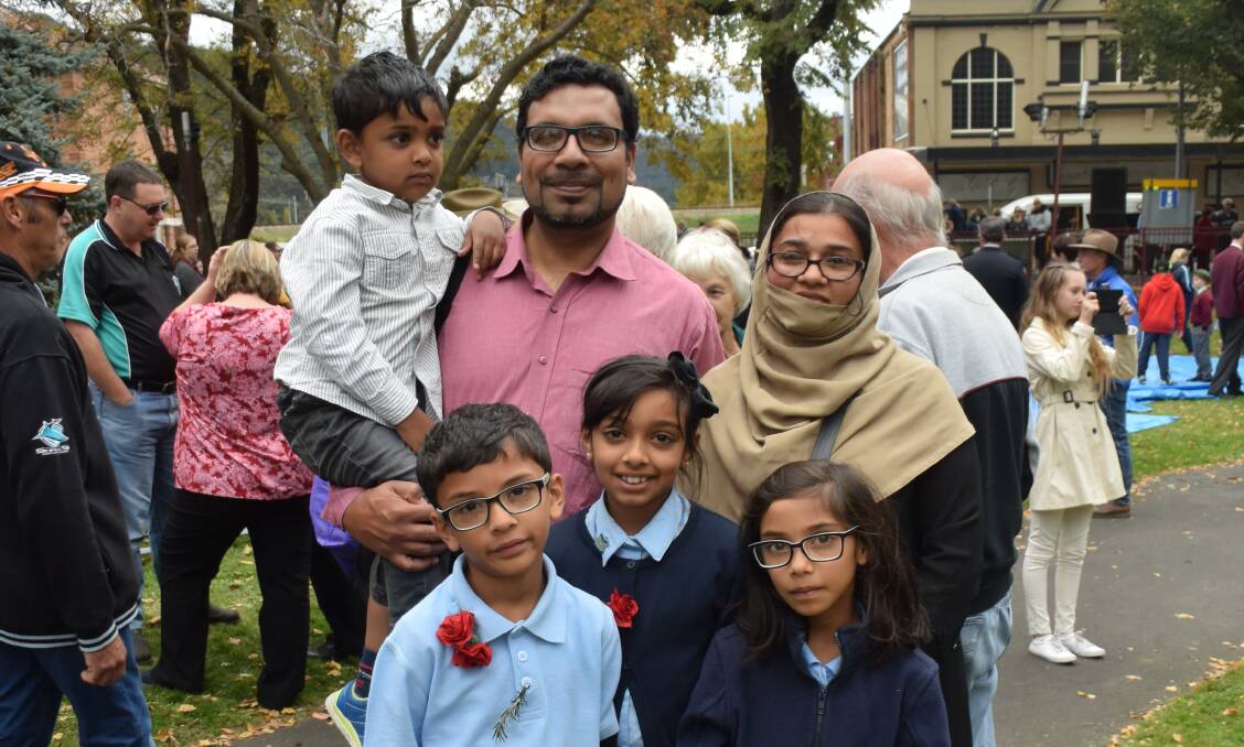 ENCOURAGING DIALOGUE: Usman and Attia-Tull-Karim Mahmood with their children at the Anzac Day service in Lithgow.