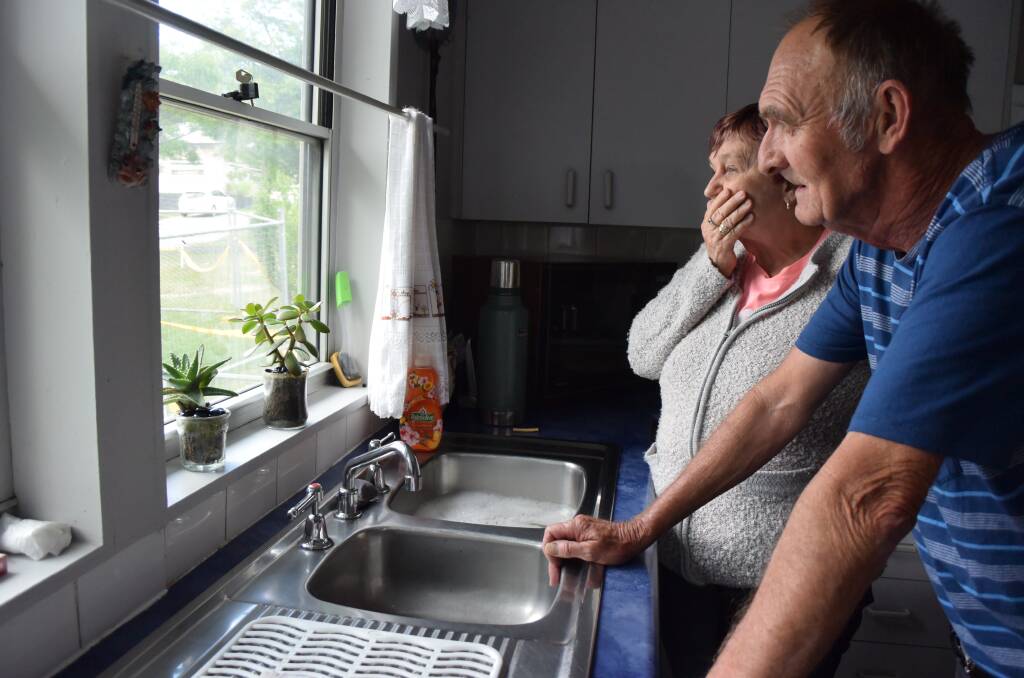 "WE PAY THE RENT": The Gavins have been looking out onto a house destroyed by a fire for four months and waiting for a gutter to be replaced for 6 years. Picture: PHOEBE MOLONEY. 