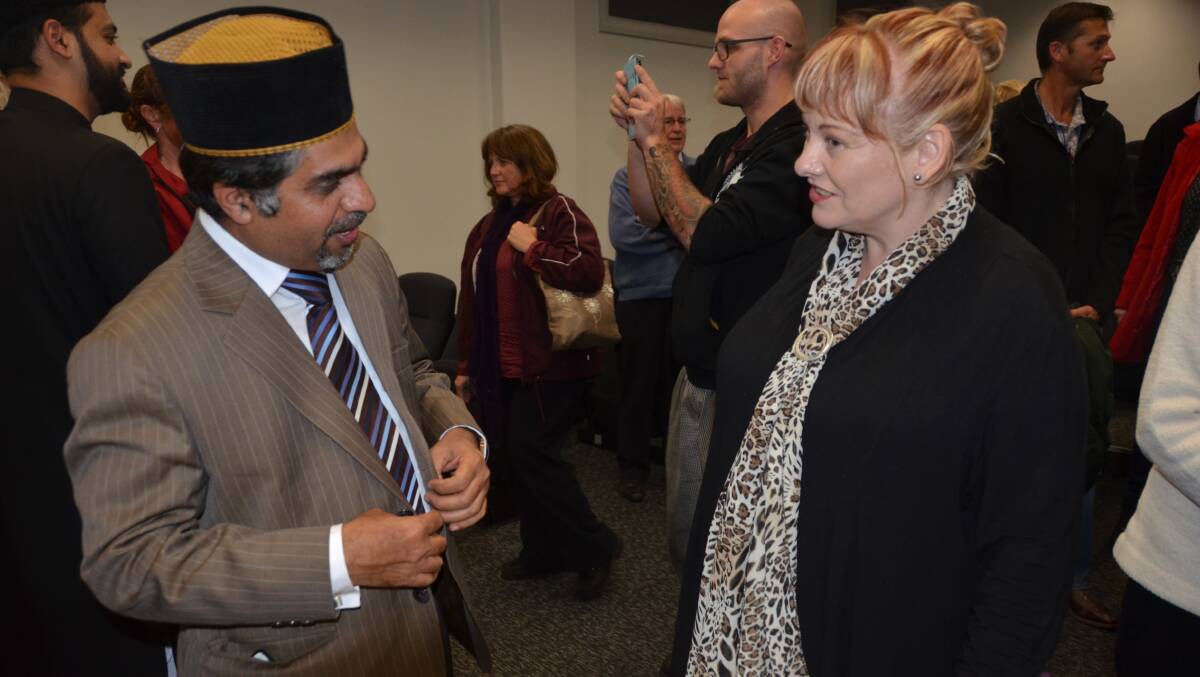 Resident Michelle Harlen speaks with the head of the Ahmadiyya branch area Lithgow is included in.