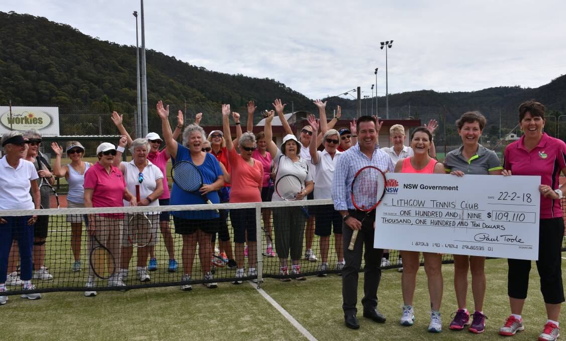 SURPRISE: Debbie Williams, Janene Grahame, Tracey Green and the Ladies Midweek Tennis competitors accept a government grant from MP Paul Toole. Picture: PHOEBE MOLONEY. 