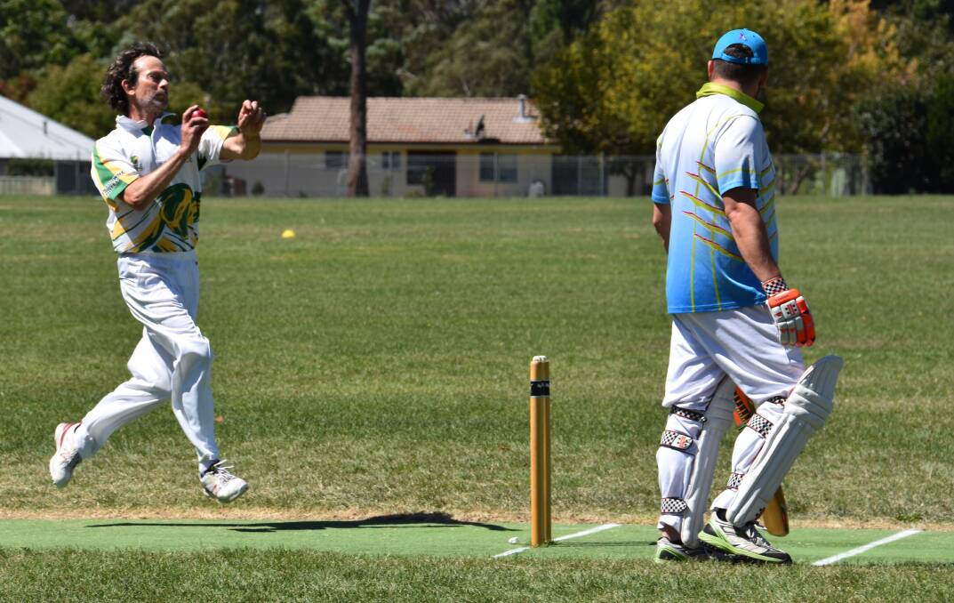 BOWL 'EM OVER: Dave Hartley in action for Lithgow Valley at the minor grand finals held at Marjorie Jackson Oval. Picture: PHOEBE MOLONEY. 