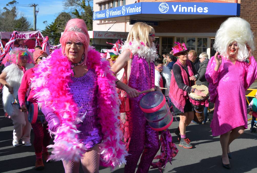 Pretty in pink: Feather boas and wigs in last year's parade.