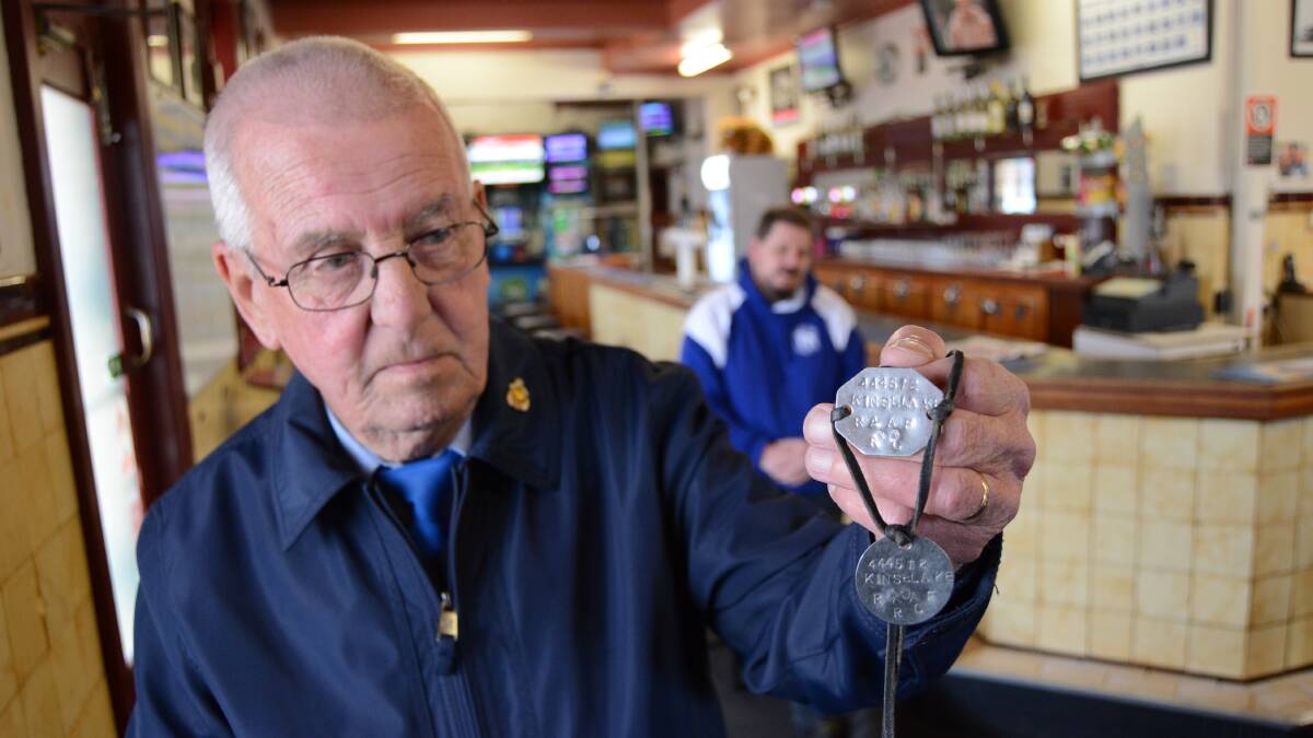 Chance find: Ted Tilley was given the dog tags of Kenneth Edmund Kinsela during the Anzac Day breakfast by the owner of the Exchange Hotel Nick Wilcox. Photo: Mark Logan.