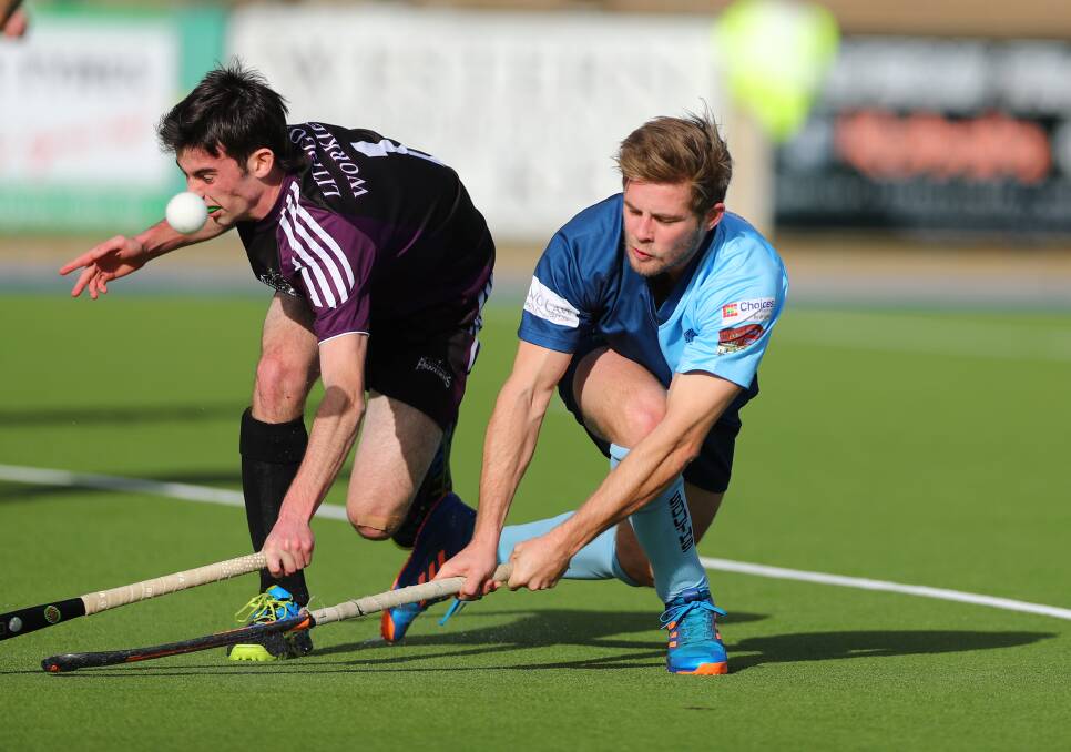 DEFEATED: Souths' Nick McEwan fires in a shot under the nose of Panthers defender Dane Guffogg in Saturday's men's Premier League Hockey match. Photo: PHIL BLATCH