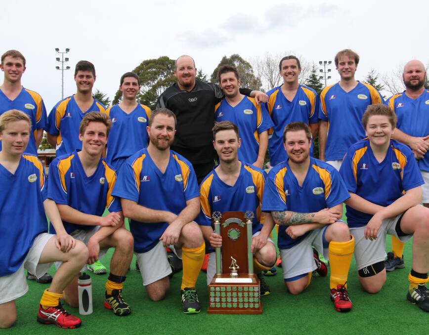 MENS HOCKEY A-GRADE PREMIERS: The Workies team stepped up in the second half to sink the Hornets. Photo: Lee Nelson.