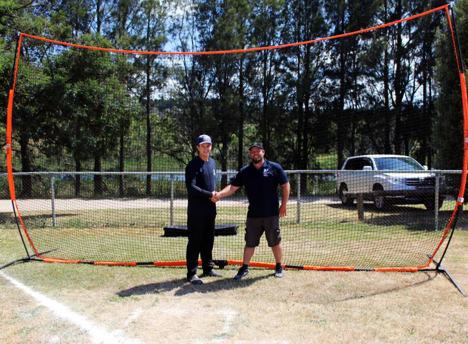Ben Smith from the Springvale Lodge Charity Assistance (Springvale Colliery) and John Kearney (President WDJBA) with the new Bownet foul ball nets (A. Bailey Photo).