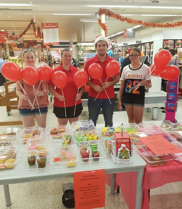 CAKE STALL FOR REDKITE: Kate, Morgan, Jesse and Olivia lend a hand to help raise funds for the worthy cause. PHOTO: Supplied.