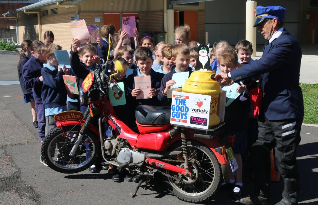 GET WELL CARDS: Lithgow Public School students deliver their letters to 'Postman Pat'.