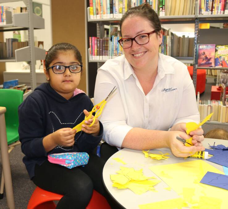 MAKING A 3D BUTTERFLY: Nimrat Hansra busy with Lithgow Library's Kellie Drengenberg. Photos: Troy Walsh.