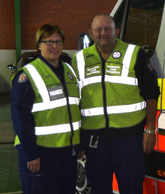 PROTEST: Lithgow paramedics Kylie Holmes and Ron Parry wore their vests last week to highlight reductions to their death and disability cover which the Union claims will cause financial hardship for paramedics.