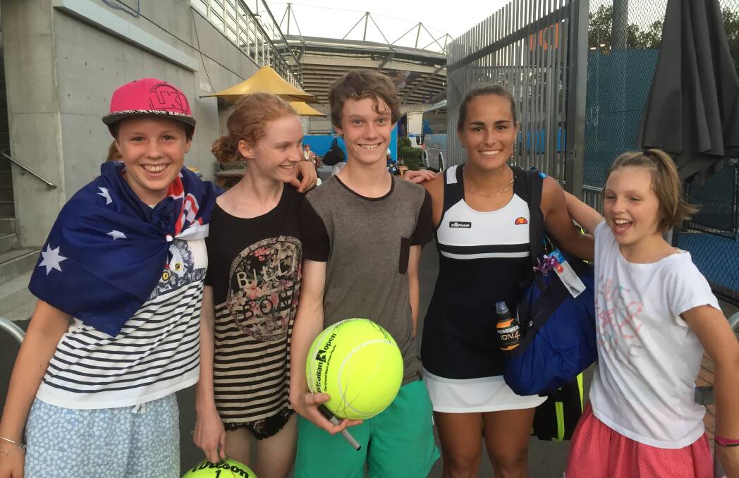 Rio gold medallist Monica Puig from Puerto Rico with Lithgow junior tennis players left to right Katie Green, Caitlin Graham, Jack Graham and Lucy Green earlier this year.