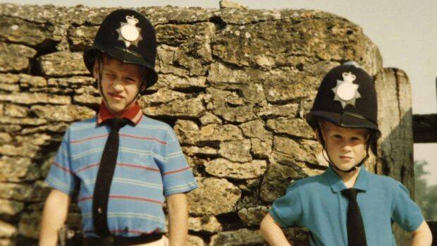 Prince William, left, and Prince Harry wear policemen outfits in a photo featured in the new documentary. Photo: The Duke of Cambridge and Prince Harry
