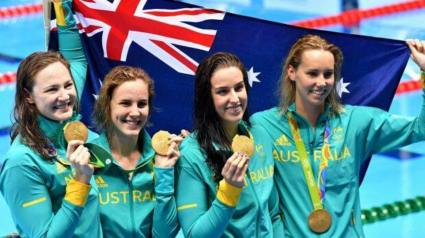 Golden girls: Australia's 4x100m freestyle relay team celebrate with their medals. Photo: Joe Armao
