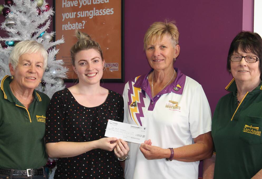 Can Assist's Ellen  Staines, Lesley Townsend and Margaret Buckley receive a donation from Westfund's Advertising and Promotions Coordinator Lauren Thompson.