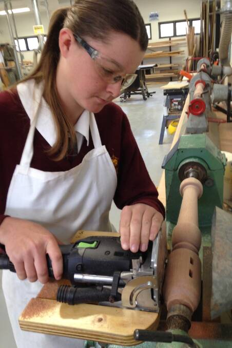 A VARIETY OF SKILLS: Grace Hadley turning wood, just one of the creative skills on offer in the TAS department.