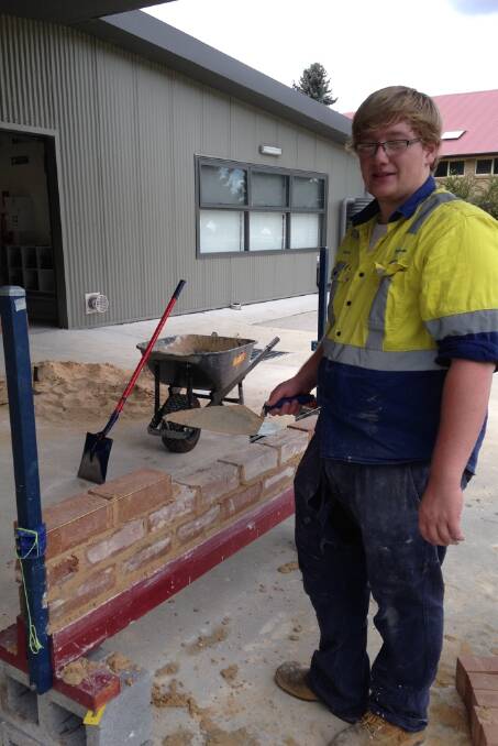 CONSTRUCTION: Josh Knight gets an insight into the world of bricklaying with his construction work.