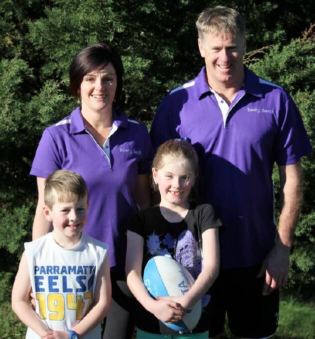Kylie and Mark Pearce and their children Marcelle and Gibson are keen for the return of the touch football season.