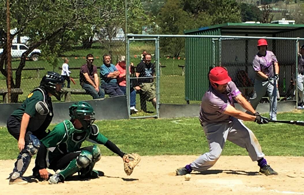 PHANTOM: Nathan Maxwell swings at a curveball in the dirt: PHOTO: K. Kearney.