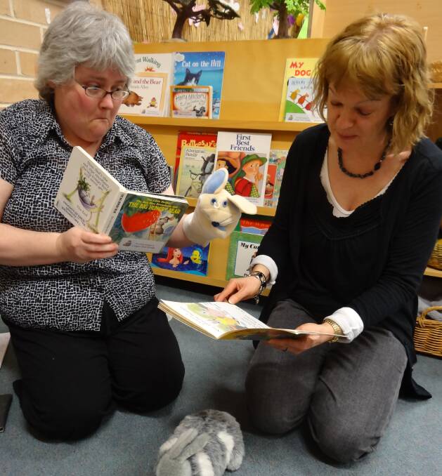 LEARNING THE ROPES: Kathy Simpson and Fran Schmitze are enjoying their work in Children's Services. PHOTO: Supplied.