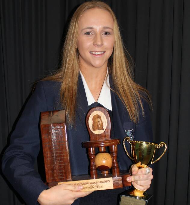 Abby Wilson with the Pierre De Coubertin Award and Jessica Dean Memorial Trophy for Sportswoman of the Year.