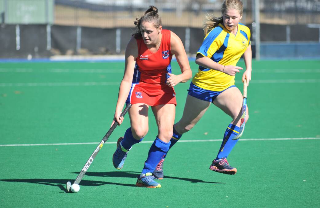 WAITING GAME: Feds gun Ellen Warner moves the ball forward in Saturday's 1-1 draw with Ex-Services. Photo: JUDE KEOGH