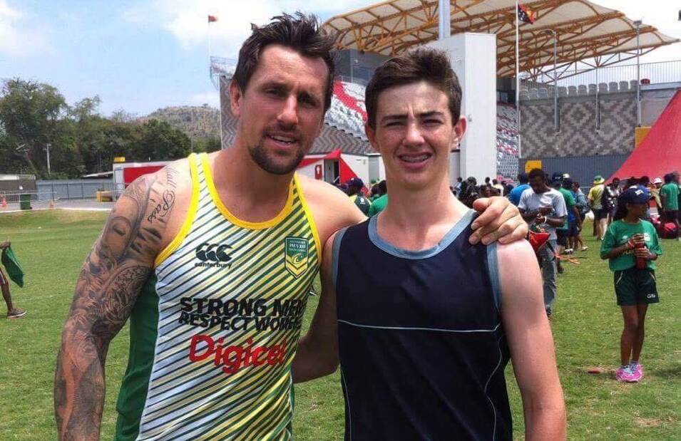 RARE OPPORTUNITY: Orange CYMS and NSW's Josh Board (right) with Prime Minister's XIII halfback Mitchell Pearce, after their opposed session in Port Moresby.