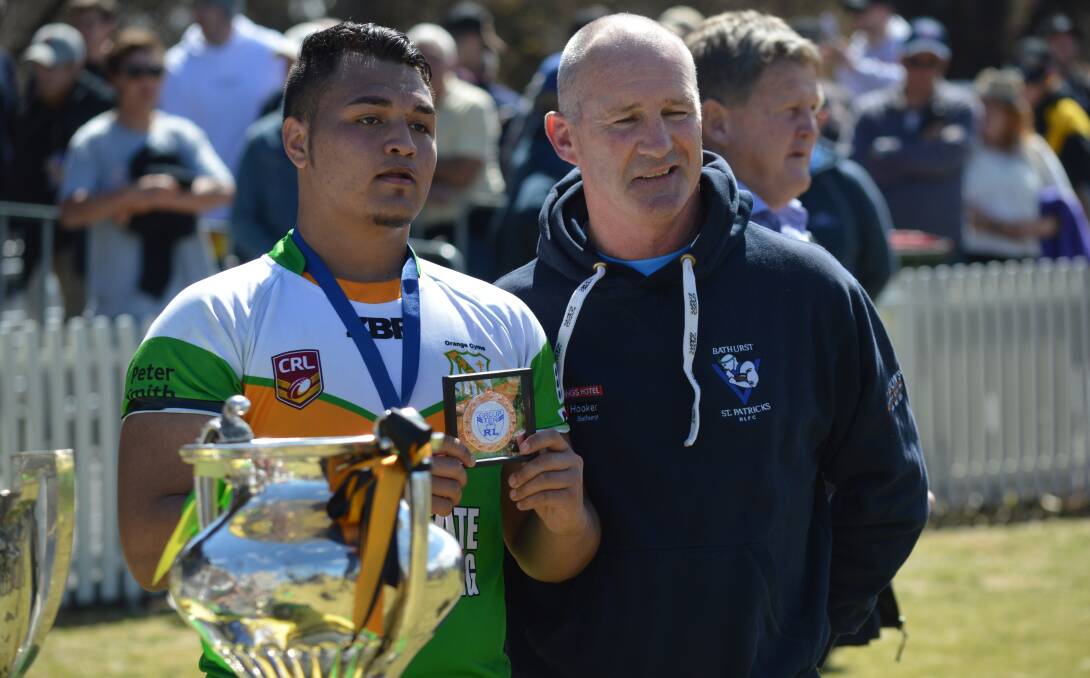 THE REAL MVP: Tyrone Harrison accepts his under 18s player of the final award on Sunday afternoon. Photo: MATT FINDLAY