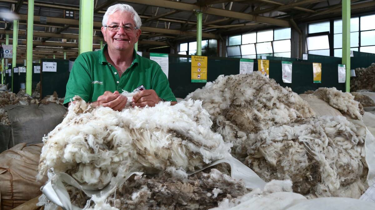 ON THE RISE: TWG Landmark wool area manager Mark Horsburgh, with wool at the AWH Bathurst Wool Store on Stewart Street. Photo: PHIL BLATCH 111317pbwool4