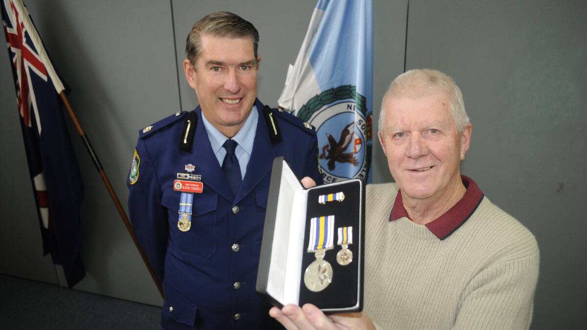 CAREER WELL SERVED: Chief Inspector Glen Cogdell, with retired police officer Bill Cox, who received the National Police Service Medal on Tuesday.