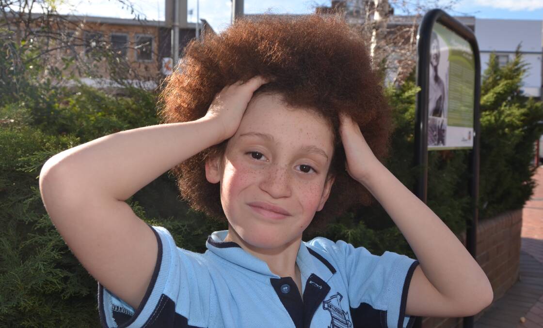 GOOD CAUSE: Wallerawang Public School student Joshua Diamond Chew will be losing his impressive head of hair in support of the Starlight Children's Foundation. Picture: HOSEA LUY
