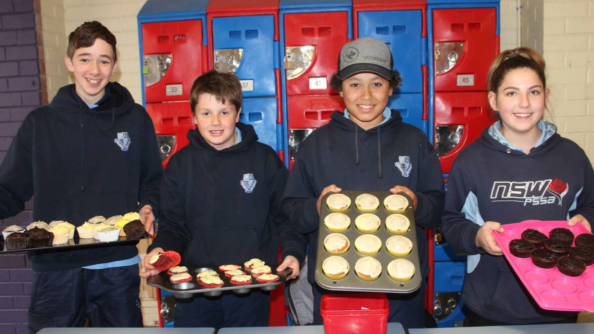 Lithgow High School SRC members Kyle Sheather, Hayden Carter, Ben Seymour and Isabella Wright presenting the cupcakes on offer on Monday. Picture: SUPPLIED
