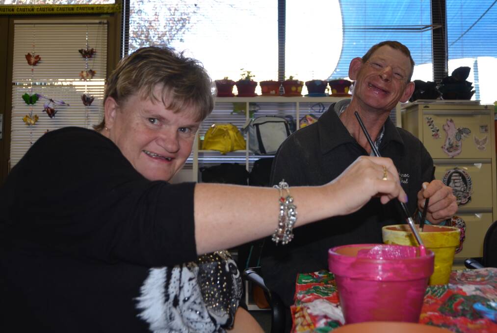 Clients at Uniting Care were given the chance to decorate their own clay pots and complete the package with some soil and plants at a DIY workshop in April. Pictures: HOSEA LUY